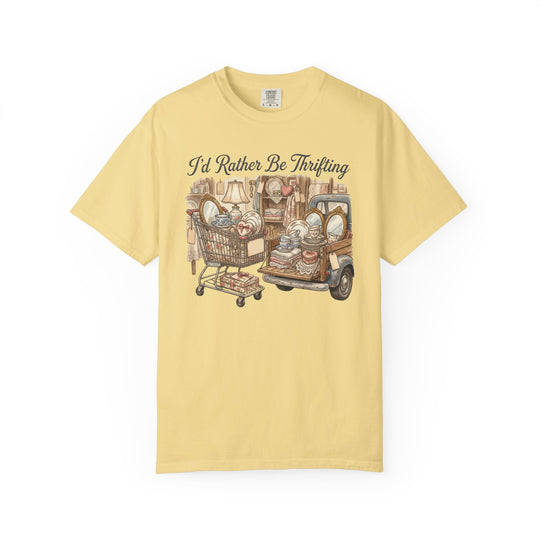 “I'd Rather Be Thrifting Tee” featuring a vintage-style illustration of a shopping cart and pickup truck loaded with thrifted treasures like dishes, textiles, and décor.