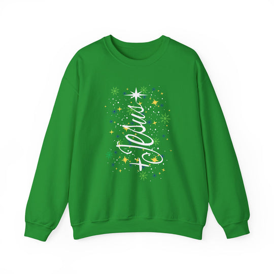 Green crew-neck sweatshirt featuring the Jesus Tree graphic with a stylized Christmas tree, star, and snowflakes, highlighting festive comfort and unisex design from Faith Family Designs.