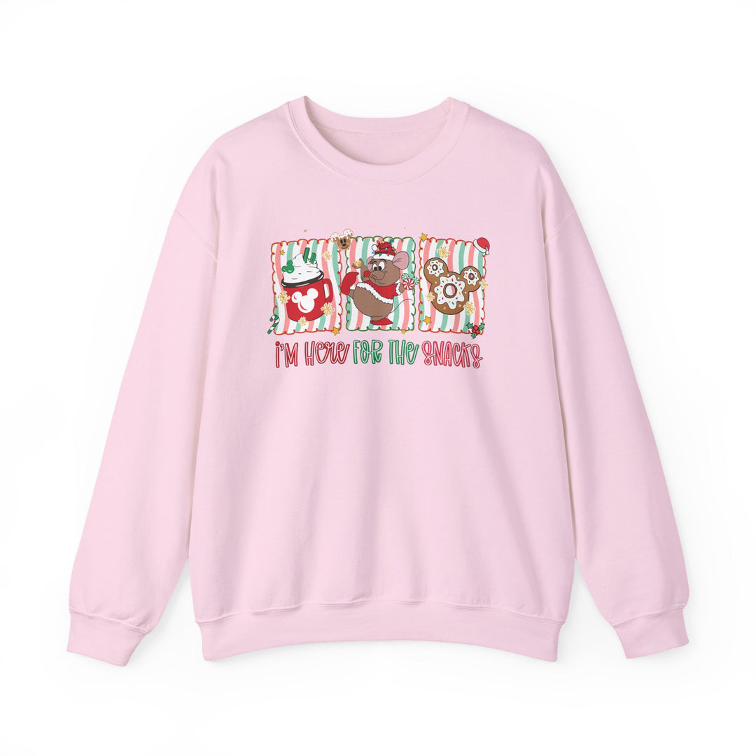 Light-pink crewneck sweatshirt featuring festive snack-themed graphics and I'm here for the snacks text, ideal for cozy, casual wear.