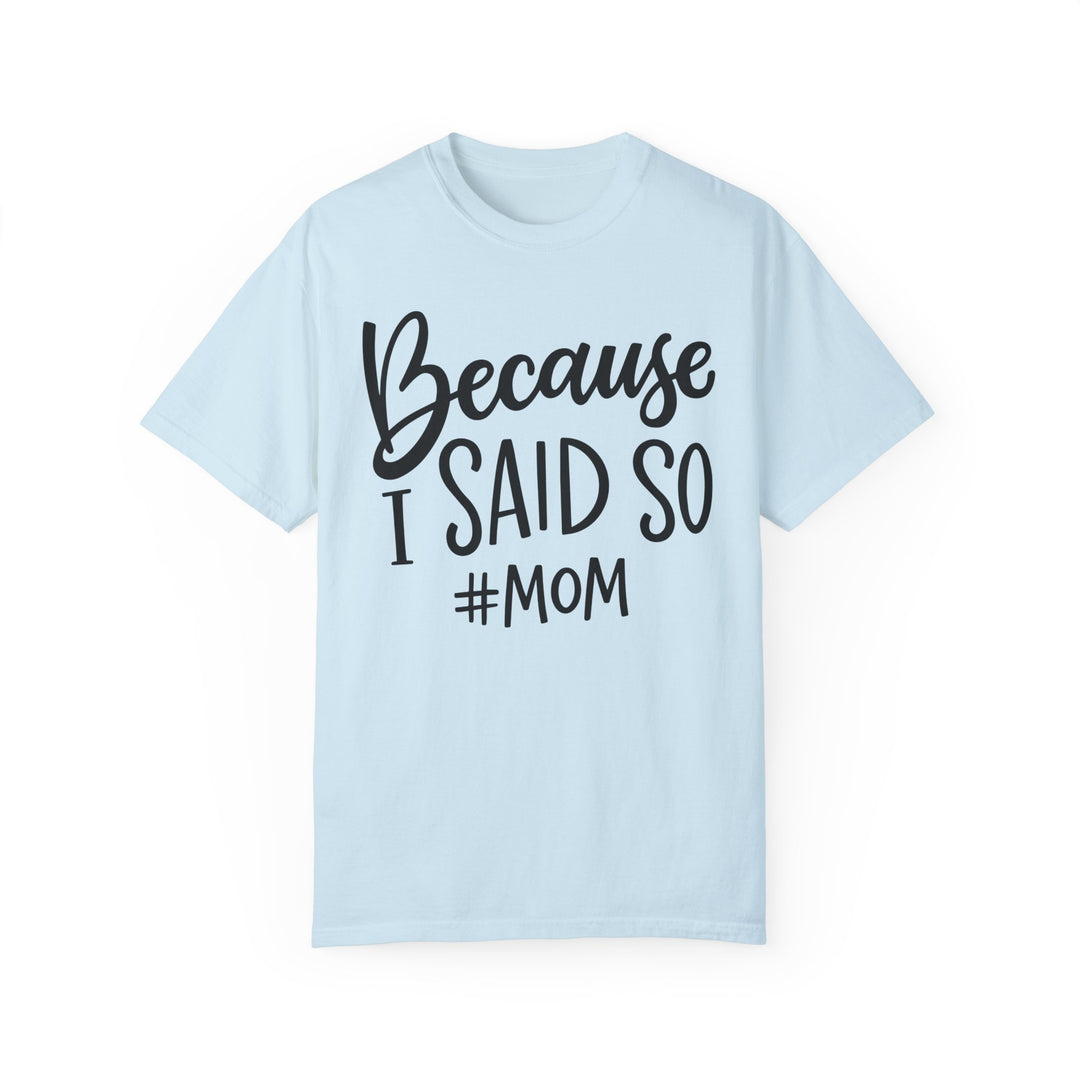 A relaxed-fit garment-dyed tee made of 100% ring-spun cotton, featuring black text on light blue fabric. Durable with double-needle stitching and tubular shape. Ideal for daily wear.
