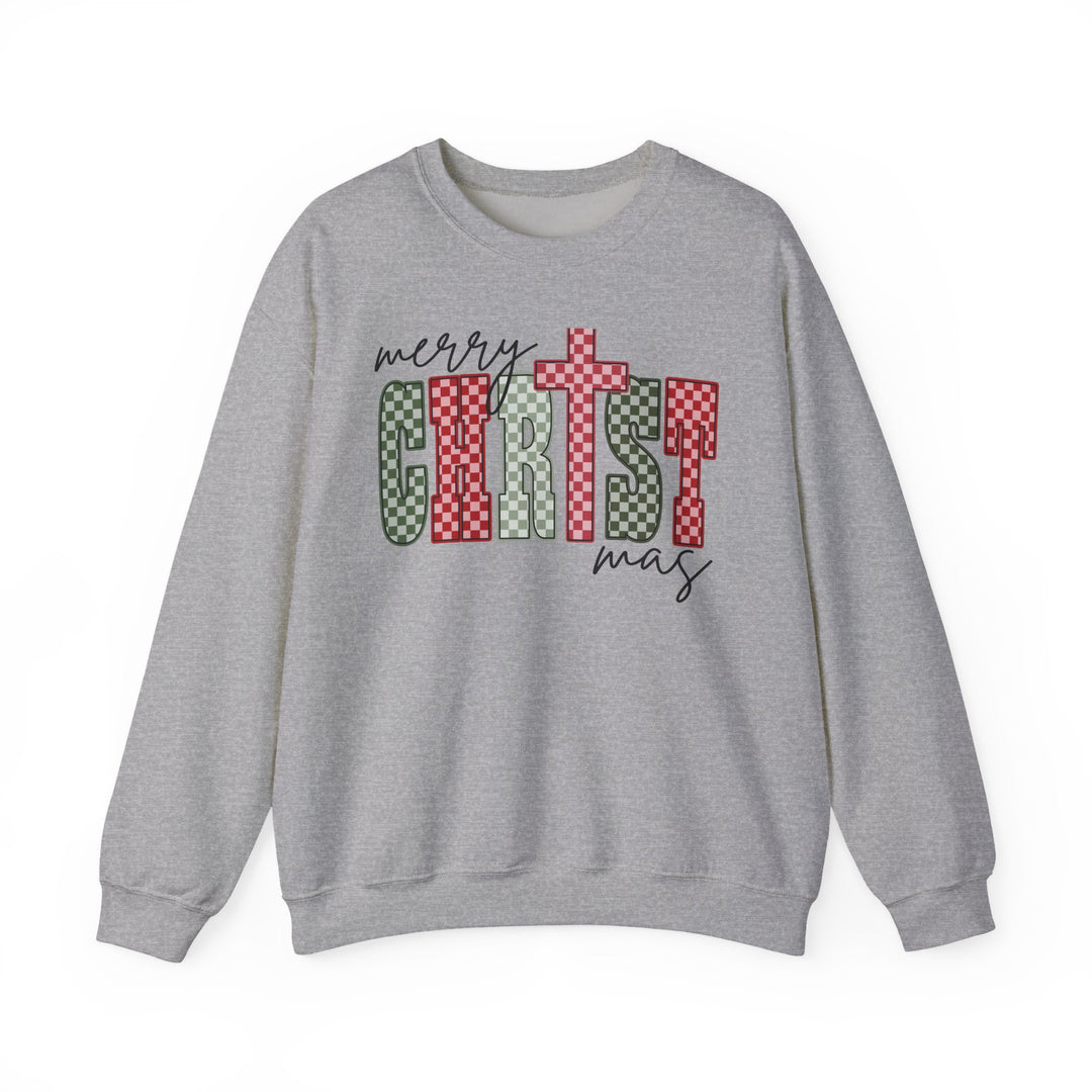 Light-grey Christmas Crew sweatshirt with merry CHRIST mas featuring a cross and checker-patterned letters, highlighting festive design. Perfect for cozy, stylish wear.