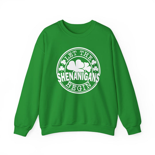 Green 'Let the Shenanigans Begin Day' crewneck sweatshirt featuring a white circle with a shamrock, offering a cozy, unisex fit with ribbed collar.