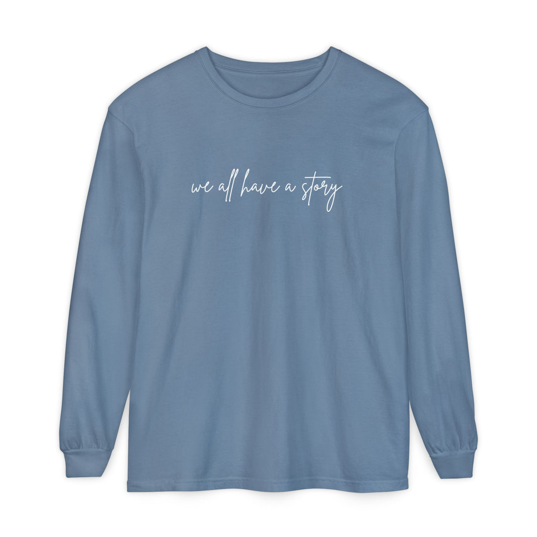 We all have a Story Long Sleeve Tee, featuring a relaxed fit with garment-dyed 100% cotton fabric, ideal for casual, comfortable wear.