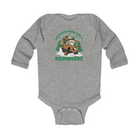 Reindeere Onesie: Heather-gray baby bodysuit with a festive monster-truck reindeer graphic, featuring a snowy scene with Christmas trees, a snowman, and playful pun caption.