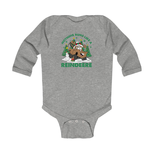 Reindeere Onesie: Heather-gray baby bodysuit with a festive monster-truck reindeer graphic, featuring a snowy scene with Christmas trees, a snowman, and playful pun caption.