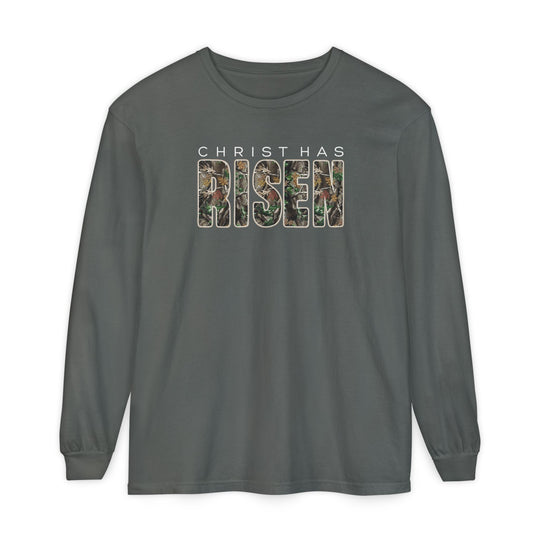 Christ has Risen Long Sleeve Tee featuring CHRIST HAS RISEN in white and camouflage print on forest-green, showcases comfort with 100% ring-spun cotton and relaxed fit.