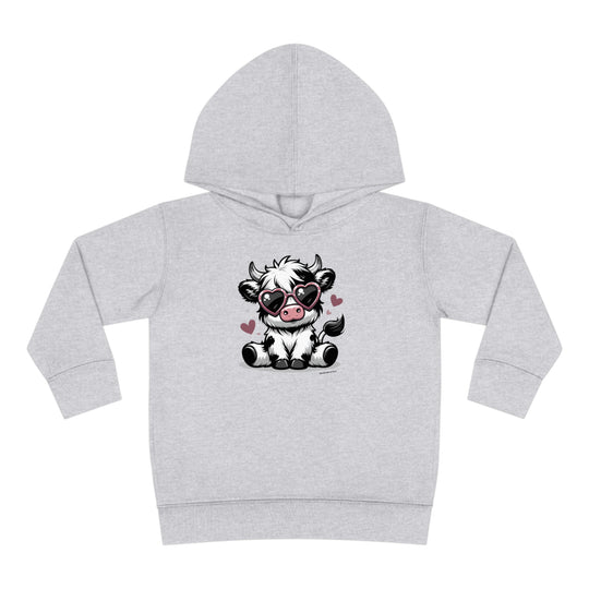 Toddler hoodie featuring a cartoon cow with sunglasses, designed for comfort and durability. Jersey-lined hood, cover-stitched details, and side seam pockets for coziness. Cute Cow Toddler Hoodie by Worlds Worst Tees.