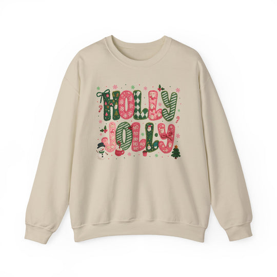 Holly Jolly Crew: Light-cream sweatshirt featuring festive HOLLY JOLLY graphic with red and green patterns, snowman, Christmas tree, and snowflake embellishments.