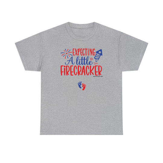 Unisex heavy cotton tee featuring Expecting a Little Firecracker text. No side seams for comfort, durable taped shoulders, and ribbed knit collar. Medium weight fabric, classic fit, 100% cotton.