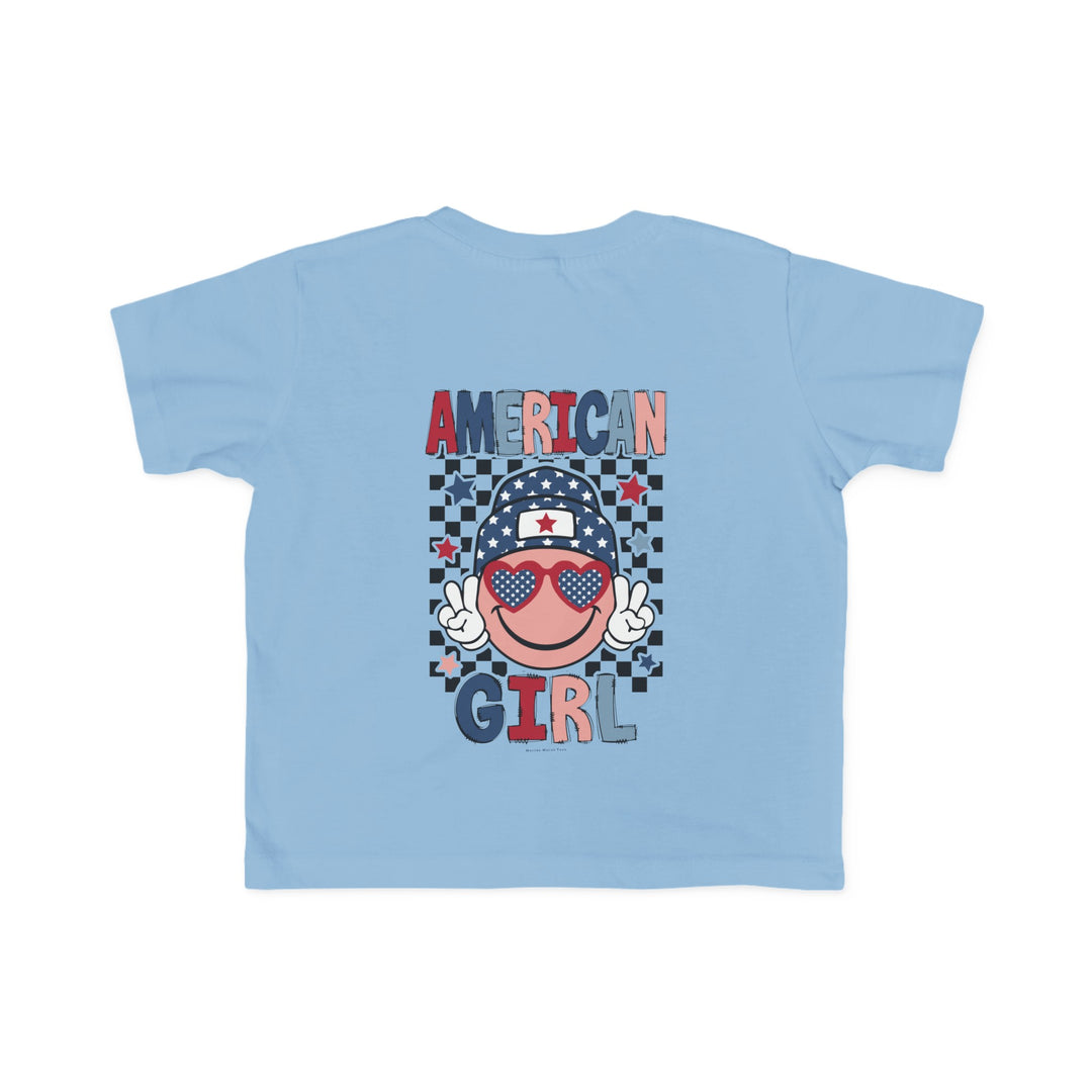 American Girl Toddler Tee featuring a blue shirt with a cartoon face and sunglasses, ideal for sensitive skin. Made of 100% combed ringspun cotton, light fabric, tear-away label, and a classic fit. Sizes: 2T, 3T, 4T, 5-6T.