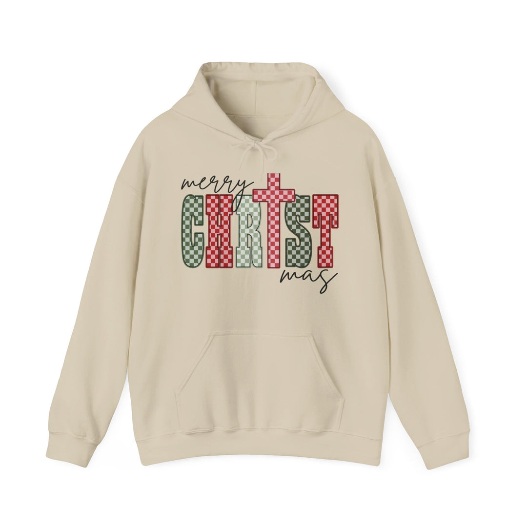 Light-tan hoodie with Merry Christmas graphic in red, white, and green, featuring a kangaroo pocket and color-matched drawstring for cozy winter wear.