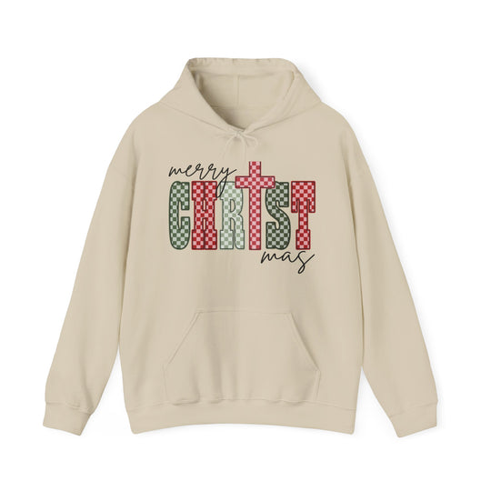 Light-tan hoodie with Merry Christmas graphic in red, white, and green, featuring a kangaroo pocket and color-matched drawstring for cozy winter wear.