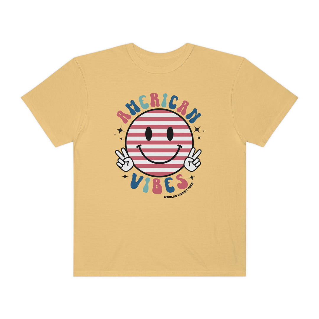 American Vibes Tee: A yellow t-shirt featuring a smiley face and peace sign. 100% ring-spun cotton, medium weight, relaxed fit, durable double-needle stitching, and seamless design for ultimate comfort and style.
