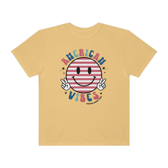 American Vibes Tee: A yellow t-shirt featuring a smiley face and peace sign. 100% ring-spun cotton, medium weight, relaxed fit, durable double-needle stitching, and seamless design for ultimate comfort and style.