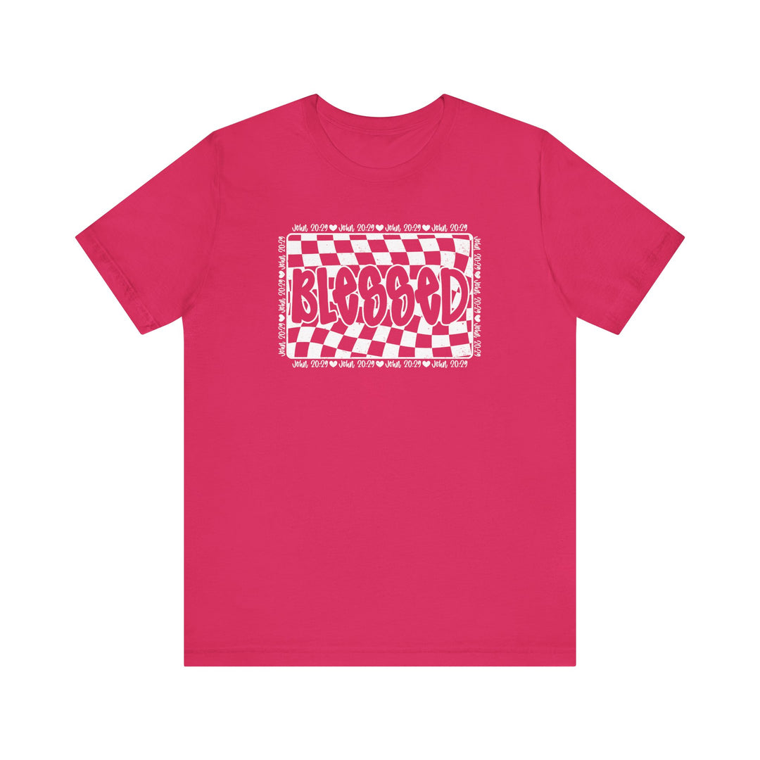 Blessed Tee: Pink short-sleeve shirt with white text, featuring a classic unisex fit, ribbed knit collar, and durable construction for lasting wear.