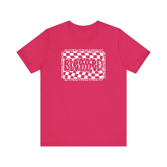Blessed Tee: Pink short-sleeve shirt with white text, featuring a classic unisex fit, ribbed knit collar, and durable construction for lasting wear.