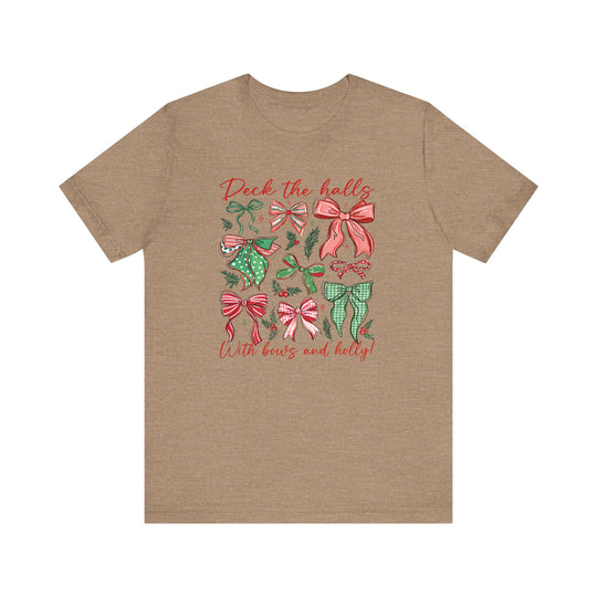 Deck the Halls Tee features nine holiday bows with holly sprigs, and festive text, printed on a heather-brown unisex short sleeve shirt.