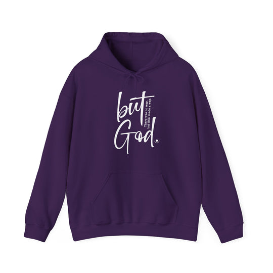 A cozy unisex But God Hoodie, blending cotton and polyester for warmth. Features a kangaroo pocket and matching drawstring hood. Ideal for chilly days. Classic fit, tear-away label. From 'Worlds Worst Tees'.