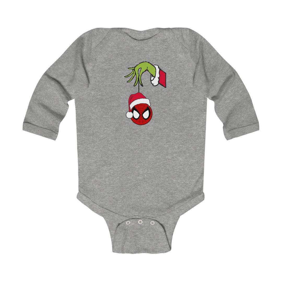 Spider Ball Christmas Onesie: Heather-gray baby bodysuit features Grinch hand holding Spider-Man ornament. Long sleeves, soft fabric, and snap closures for easy diaper changes.