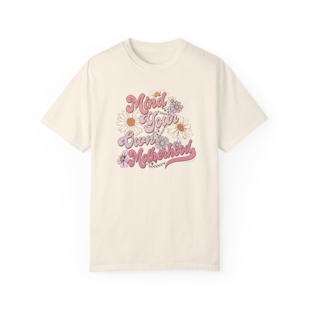 A garment-dyed Mind Your Motherhood Tee, 100% ring-spun cotton, with double-needle stitching for durability. Soft-washed fabric, relaxed fit, no side-seams for comfort and style. From Worlds Worst Tees.