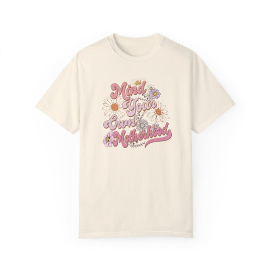 A garment-dyed Mind Your Motherhood Tee, 100% ring-spun cotton, with double-needle stitching for durability. Soft-washed fabric, relaxed fit, no side-seams for comfort and style. From Worlds Worst Tees.