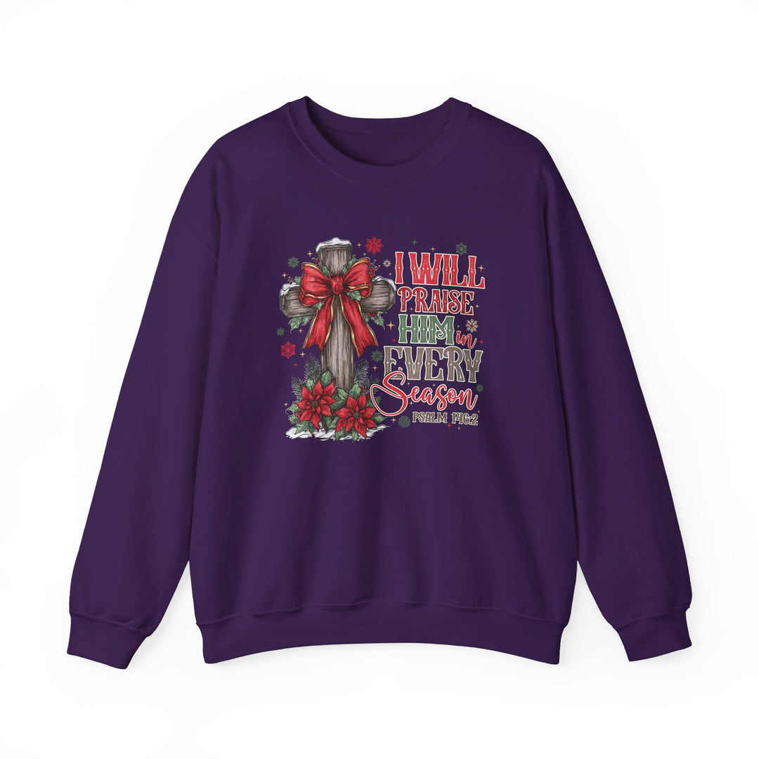 Purple crew-neck sweatshirt with festive, faith-based design featuring a cross with a holiday bow, poinsettias, and Psalm 146:2 text.