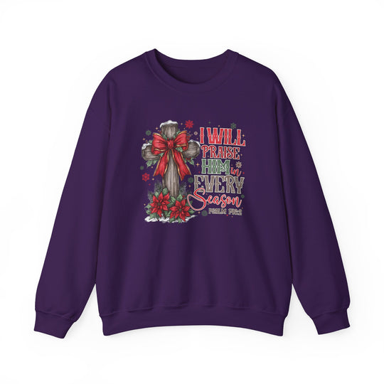 Purple crew-neck sweatshirt with festive, faith-based design featuring a cross with a holiday bow, poinsettias, and Psalm 146:2 text.