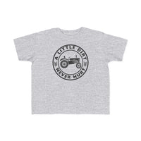 Toddler T-shirt featuring a tractor graphic with the text A LITTLE DIRT NEVER HURT, designed for comfort and durability, perfect for young adventurers.