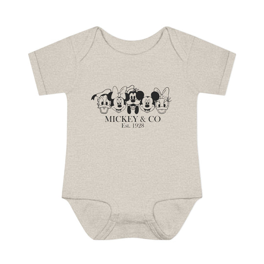 Mickey and CO Onesie featuring lap shoulders for easy dressing, crafted from soft 100% ring-spun cotton, designed for infant comfort and fit.