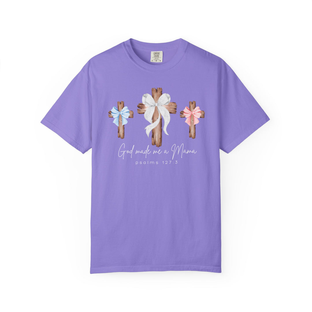 Lavender cotton T-shirt with three wooden crosses, adorned with bows, and script God made me a Mama and psalms 127:3, by Comfort Colors.
