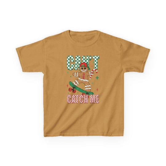 Can't Catch Me Kids Tee features a gingerbread cookie on a skateboard with holiday-themed lettering, offering a festive, durable, and comfortable design for everyday wear.