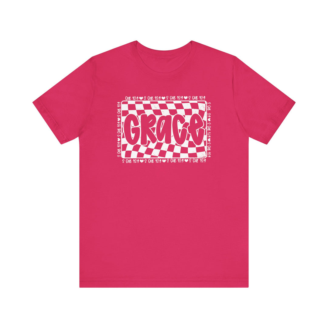 Grace Tee: Pink t-shirt with white text, featuring a unique design. Classic unisex fit with ribbed collars and durable seams for comfort and style.