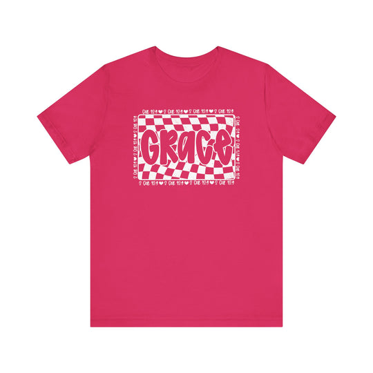 Grace Tee: Pink t-shirt with white text, featuring a unique design. Classic unisex fit with ribbed collars and durable seams for comfort and style.