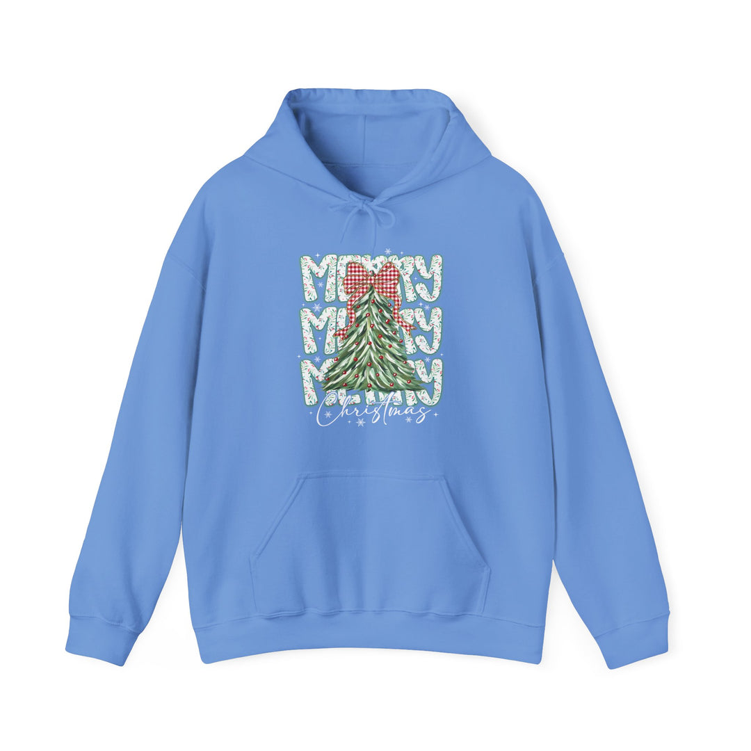 Light-blue hoodie featuring a festive Christmas tree graphic, MERRY text, and Christmas script, with kangaroo pocket and drawstring hood for cozy wear.