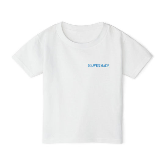 Heavy Cotton™ Toddler T-shirt with “HEAVEN MADE” in blue on chest, offering eco-friendly style and comfort with 100% cotton, designed for everyday wear.