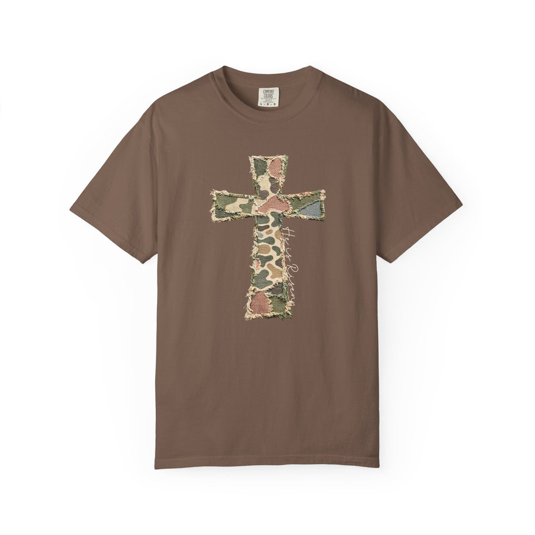 He is Risen Distressed Tee: Brown, short-sleeve shirt with frayed camouflage cross motif and cursive 'He is Risen' script, offering comfort and durability in size L.
