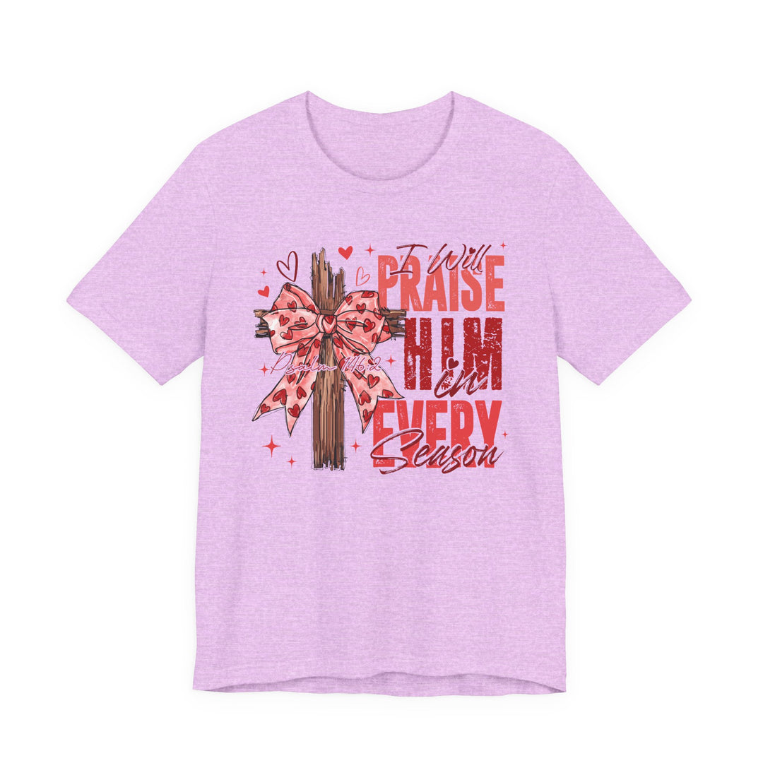 Praise in Every Season Heart Tee with a rustic wooden cross and heart-patterned bow, featuring “Psalm 146:2” and bold red lettering.