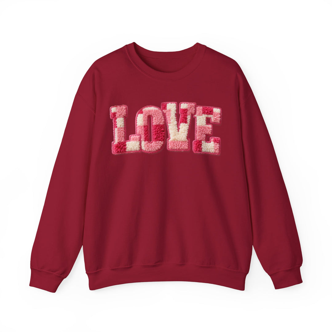 Love Crew sweatshirt with LOVE in fuzzy chenille letters, relaxed fit, ribbed cuffs, ideal for comfort. Made from a polyester-cotton blend, unisex design.