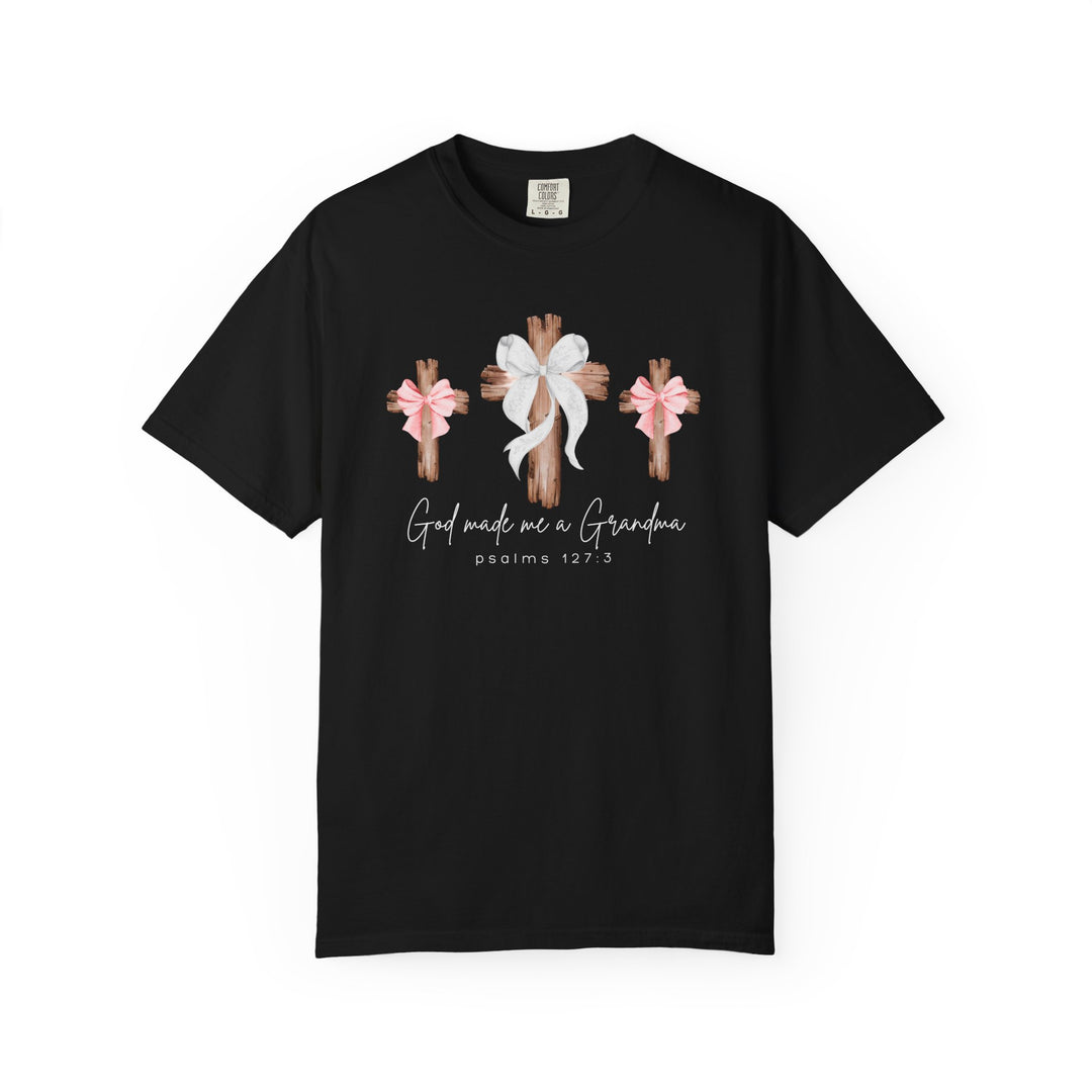God Made Me a Grandma Tee features rustic wooden crosses and the phrase 'psalms 127:3,' offering comfort and style with a relaxed fit.