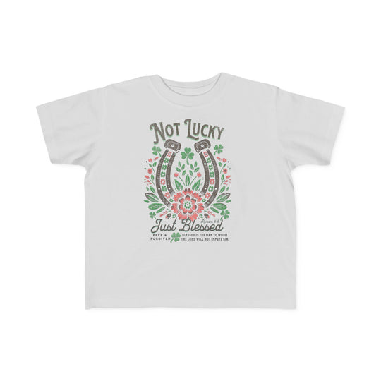 Blessed Toddler's Tee features a graphic design of flowers and horseshoes, crafted from soft cotton, ideal for toddlers' sensitive skin. Perfect for first adventures.