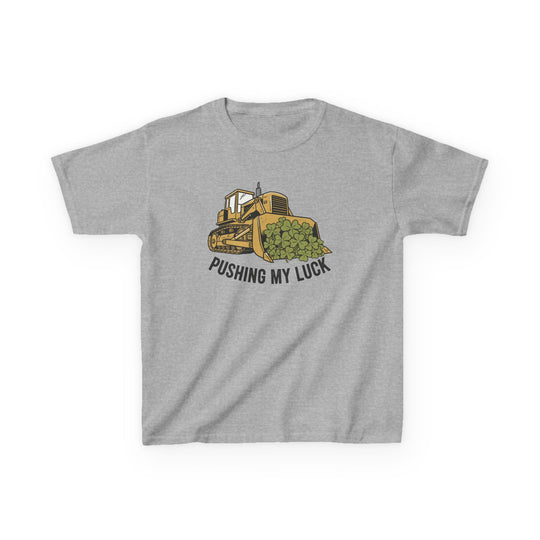 Light-gray Pushing My Luck kids tee, featuring a bulldozer graphic with clover leaves, made from durable, soft cotton, perfect for everyday wear.