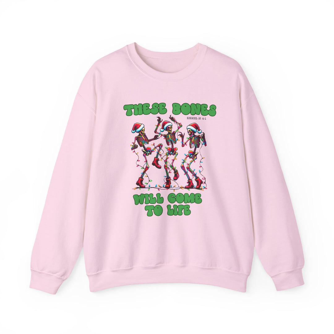 Bones Come to Life Crew sweatshirt featuring dancing skeletons in Santa hats with Christmas lights, Ezekiel 37:4-5 reference, on light-pink fabric.