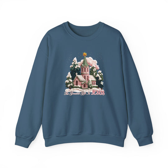 Gift is Jesus Crew sweatshirt with a serene snow-covered church scene, fir trees, and star, highlighting the message: “The Greatest Gift is JESUS.” Perfect for cold seasons.