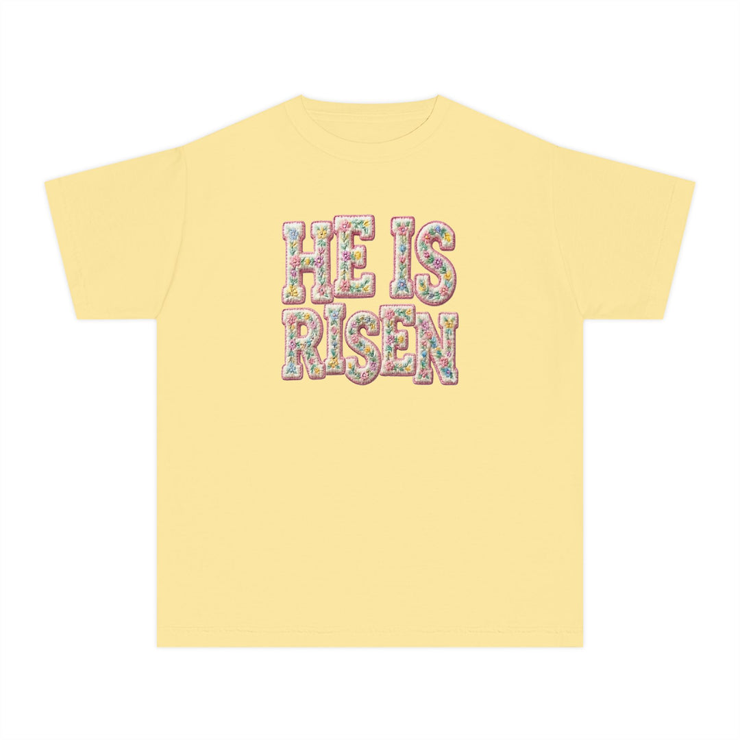 He is Risen Kids Tee with pastel floral lettering on pale yellow, short-sleeve. Perfect for active kids, crafted from soft, 100% combed ring-spun cotton.