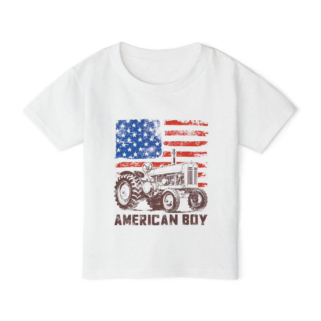 American Boy Toddler Tee featuring a distressed American flag above a vintage tractor illustration, crafted from soft, eco-friendly cotton for toddlers.