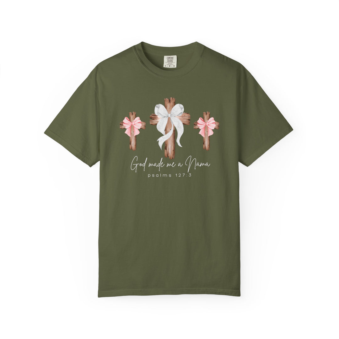 Olive-green T-shirt featuring three rustic wooden crosses with bows and the text 'God made me a Nana' and 'psalms 127:3,' ideal for casual wear.