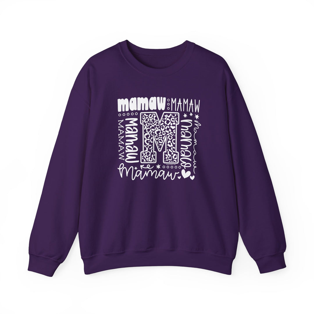 A cozy Mamaw Crew unisex sweatshirt in purple with white letters. Made of 50% cotton and 50% polyester, featuring a ribbed knit collar and double-needle stitching for durability. Ideal for colder months.