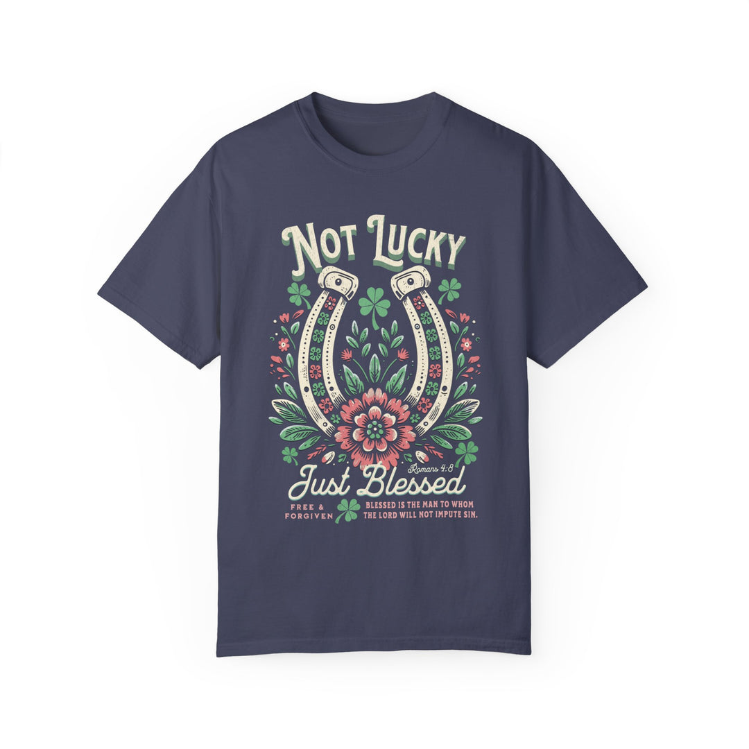 Blessed Tee featuring a graphic of a horseshoe and flowers, on a blue background. Comfortable, durable, and customizable, perfect for casual wear.