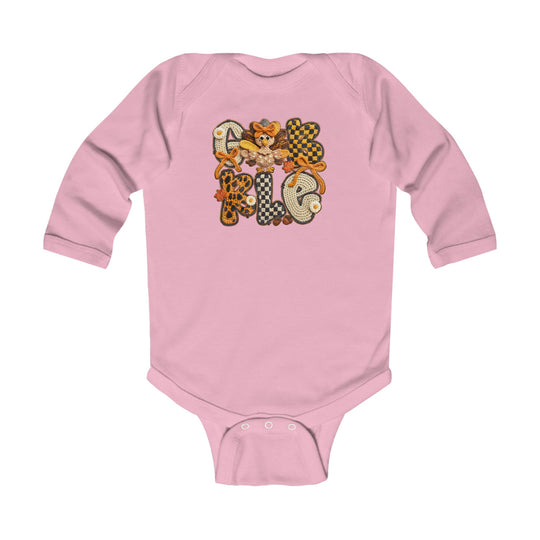 Gobble Onesie: Pink baby bodysuit featuring GOBBLE with fall-themed patterns and a whimsical turkey, designed for comfort with soft cotton and durable ribbed knitting.