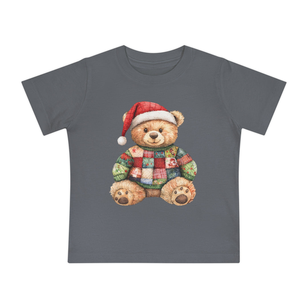 Christmas Bear Baby Tee features a charcoal-gray T-shirt with a teddy bear in a Santa hat and patchwork sweater, ideal for stylish, comfortable first steps.
